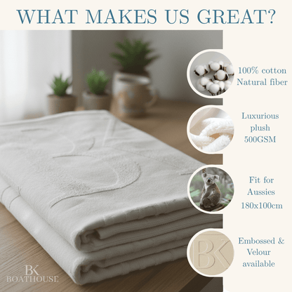 Folded towel on a wooden surface with product features listed.